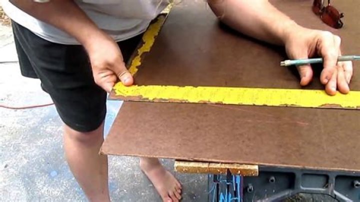 How do you cut a tempered brown hardboard?