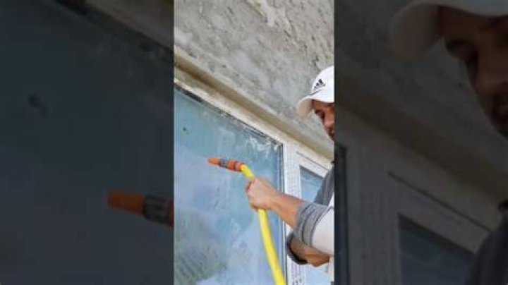 How do you remove hardened cement from glass?