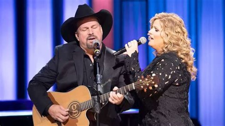 Who were John Prine's first two wives?